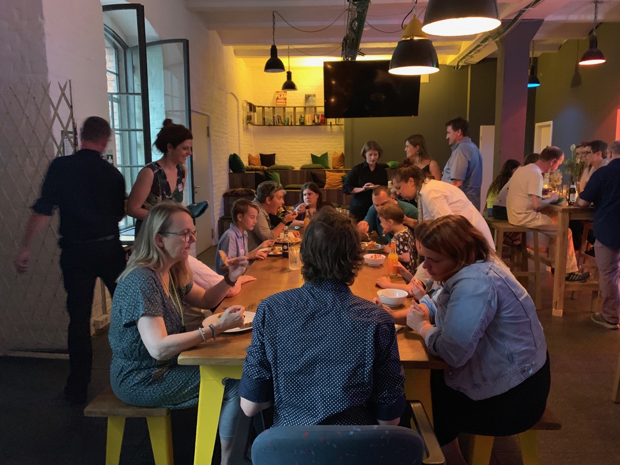 People enjoying food and drinks during the celebration
